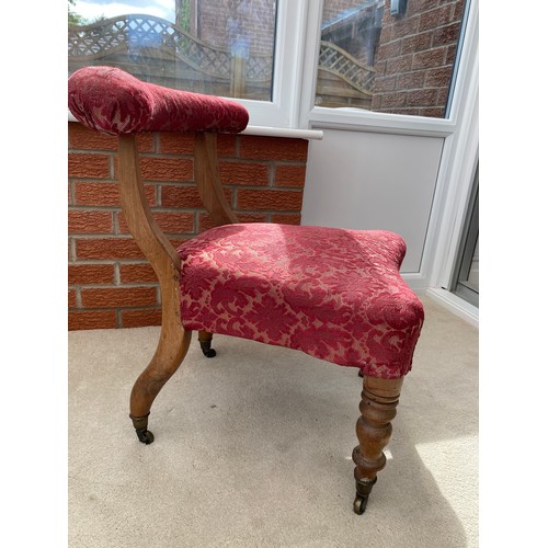 140 - A 19thC occasional chair with turned front legs and upholstered top rail on castors. 67 h x 51 w to ... 