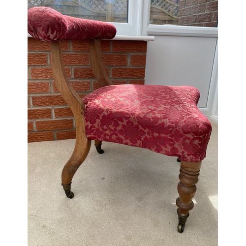 140 - A 19thC occasional chair with turned front legs and upholstered top rail on castors. 67 h x 51 w to ... 