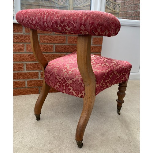 140 - A 19thC occasional chair with turned front legs and upholstered top rail on castors. 67 h x 51 w to ... 