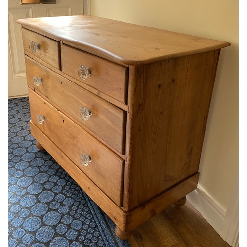 143 - A 19thC pine chest of 2 short over 2 long drawers, serpentine front with glass knobs. 82 h x 102 w x... 