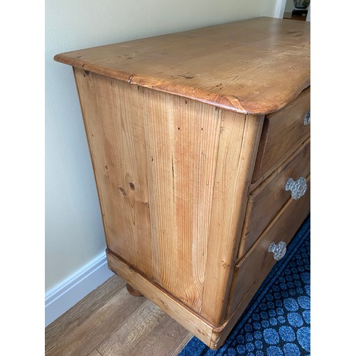 143 - A 19thC pine chest of 2 short over 2 long drawers, serpentine front with glass knobs. 82 h x 102 w x... 