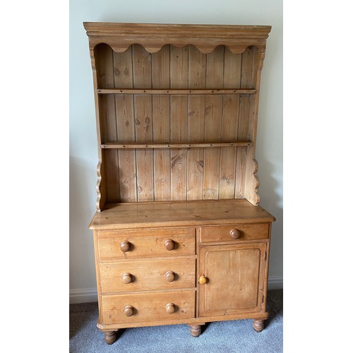 144 - Pine dresser with 3 drawers to left side, single drawer and cupboard to right with raised back with ... 