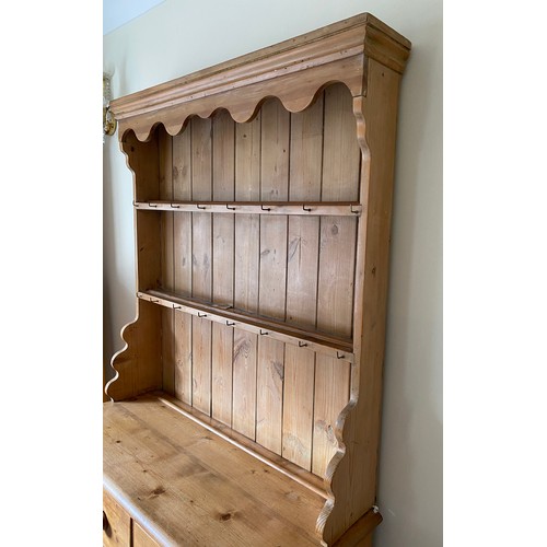 144 - Pine dresser with 3 drawers to left side, single drawer and cupboard to right with raised back with ... 