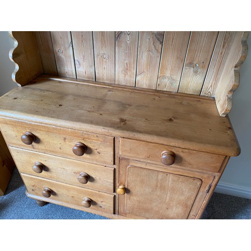 144 - Pine dresser with 3 drawers to left side, single drawer and cupboard to right with raised back with ... 