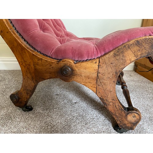 145 - A 19thC scrolled form upholstered chair on castors. 78 h x 47 w x 36cm to seat.