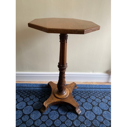 146 - A mahogany occasional table with well carved pedestal.