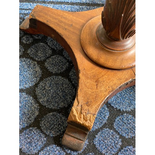 146 - A mahogany occasional table with well carved pedestal.