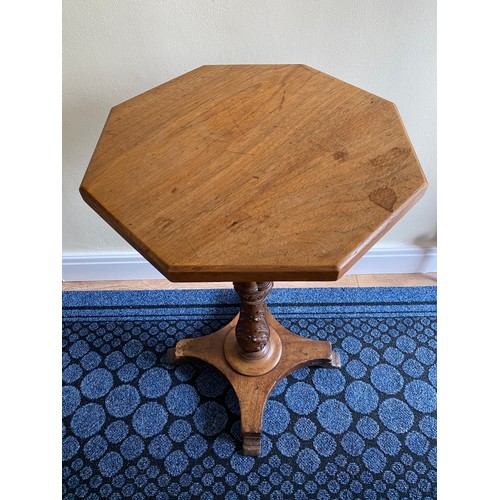 146 - A mahogany occasional table with well carved pedestal.