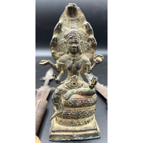 768 - Antique bronze figure of Shiva 15cm h with a pair of metal spear heads mounted on wooden stands.