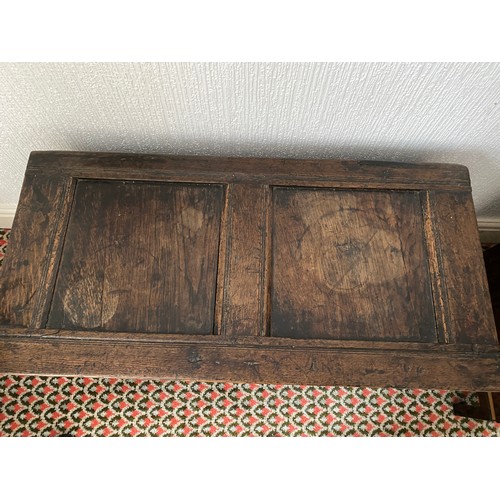 78 - An 18thC oak coffer with carving to frieze and panels. Metal handles to sides. 97 w x 48 d x 59cm h.