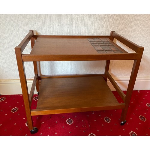 86 - A mid 20thC teak and tiled trolley. Made in Denmark.