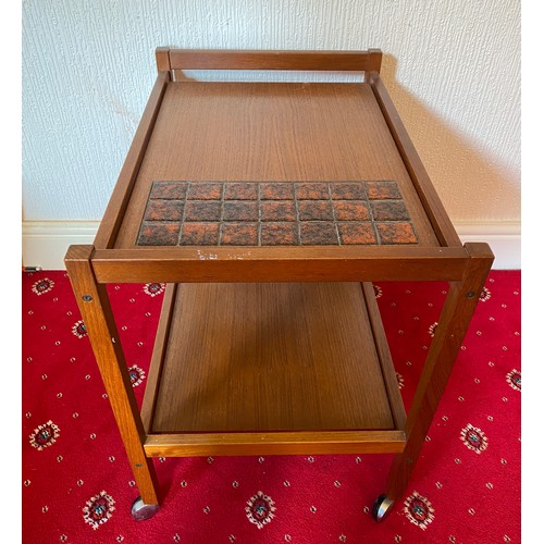 86 - A mid 20thC teak and tiled trolley. Made in Denmark.