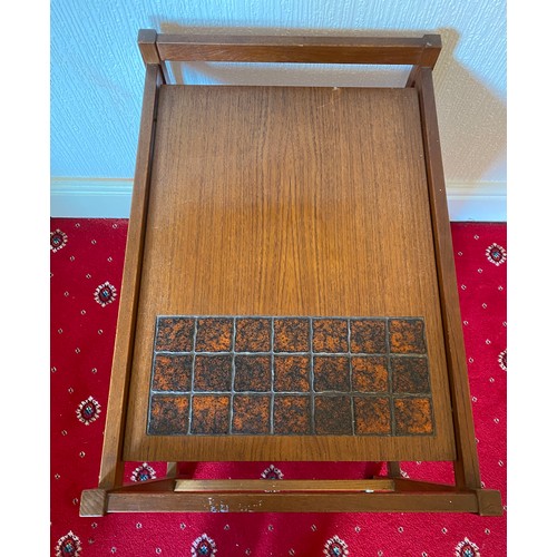 86 - A mid 20thC teak and tiled trolley. Made in Denmark.