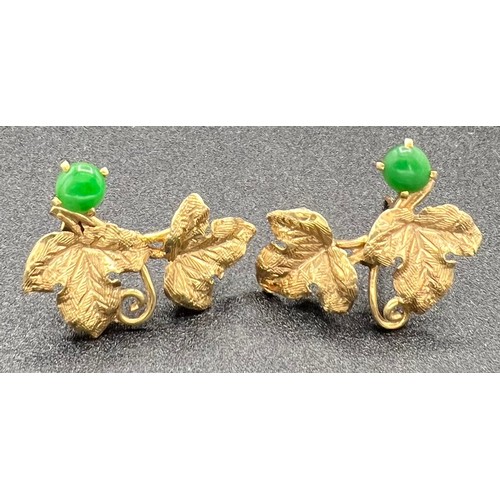 569 - Yellow metal leaf earrings set with jade. Test as 18ct gold. 3.5gm. 25mm l.