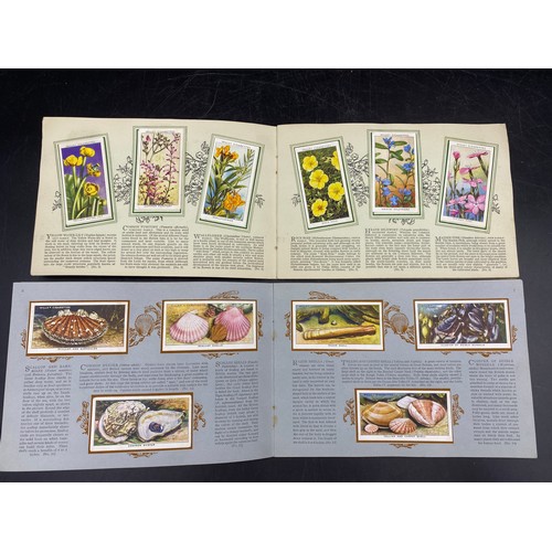 1063 - Five complete albums of cigarette cards to include three Park Drive:- The Navy 1937, Dogs 1937, Trai... 