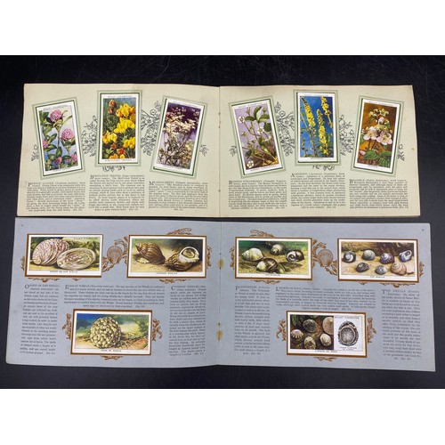 1063 - Five complete albums of cigarette cards to include three Park Drive:- The Navy 1937, Dogs 1937, Trai... 