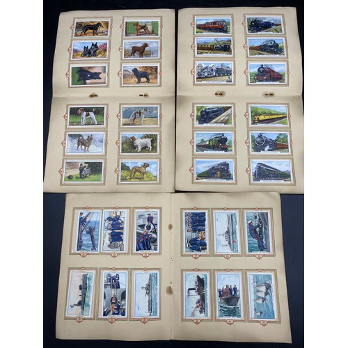 1063 - Five complete albums of cigarette cards to include three Park Drive:- The Navy 1937, Dogs 1937, Trai... 