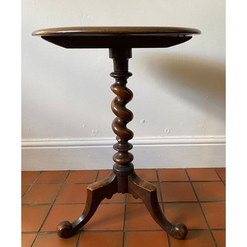 72 - A twist stem mahogany occasional table. 67 h x 49cm d.