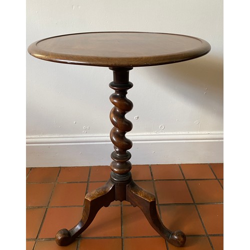 72 - A twist stem mahogany occasional table. 67 h x 49cm d.