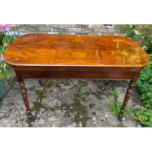 74 - Mahogany inlaid side table on turned legs with castors. Measuring 74cm h, 122cm w,  60 cm d.