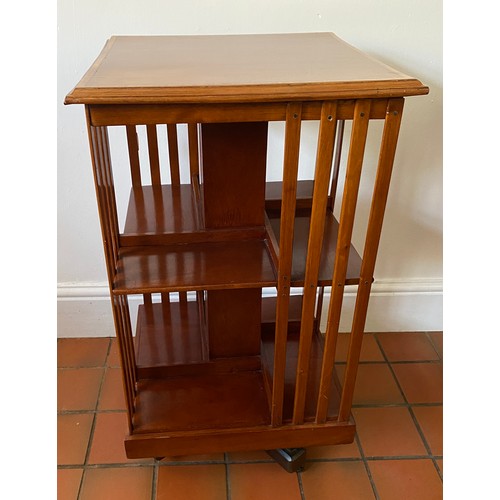 75 - Mahogany revolving bookcase, inlay to edge. 83cm h x 47cm square.