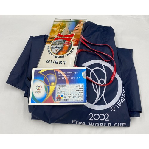 1064 - A 2002 FIFA World Cup used ticket in Budweiser Lanyard together with a 2002 FIFA World Cup hooded ca... 