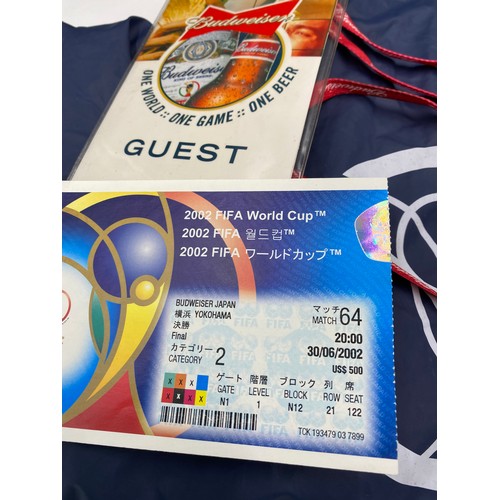 1064 - A 2002 FIFA World Cup used ticket in Budweiser Lanyard together with a 2002 FIFA World Cup hooded ca... 