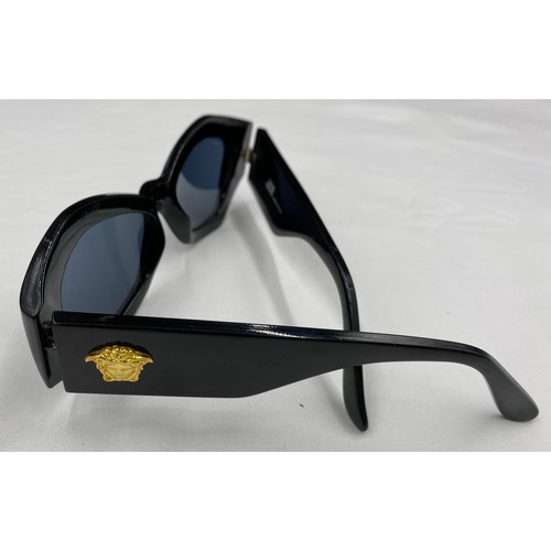 711 - Gianni Versace ladies sunglasses, black, original case, grey lenses. Model Mod.421 colour Col.852.