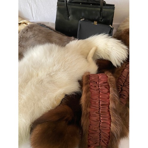 713 - A selection of fur collars to include white fox, fox etc together with a fox scarf, a  black leather... 