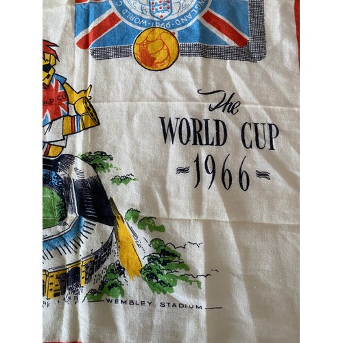 714 - A 1966 World Cup commemorative handkerchief depicting WC Willie kicking a ball over an image of Wemb... 