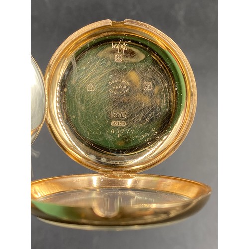 911 - A 9ct gold cased pocket watch. Dennison watch case company. 5cm d. 84gm.