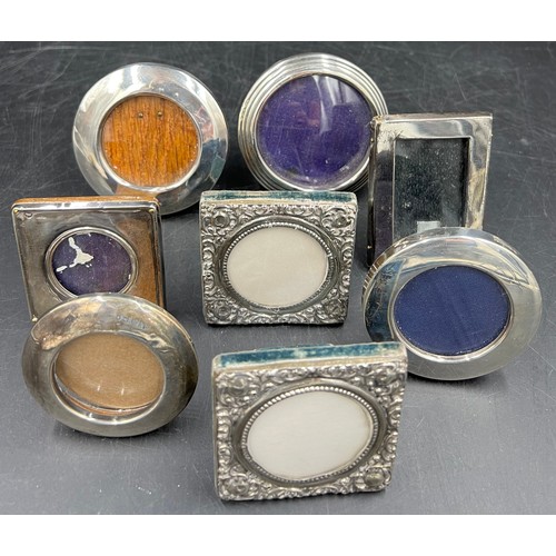 805 - Eight small square and circular silver photograph frames, various dates and makers, largest 8cm d.