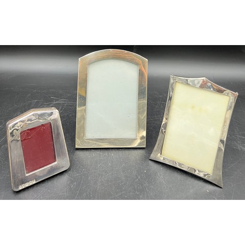 811 - Three silver photograph frames, various dates and makers. Largest 16.5 x 12cm.