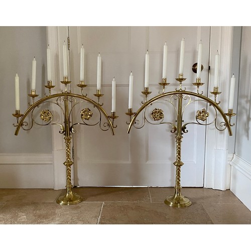 937 - A pair of large brass Gothic Revival candelabra (bought from Libertys London) 79 x 65cm w.