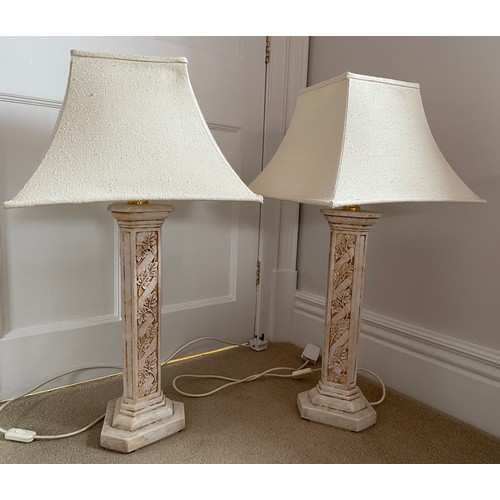 1077 - Two painted terracotta lamps with shades. 60cm h to fitting top.