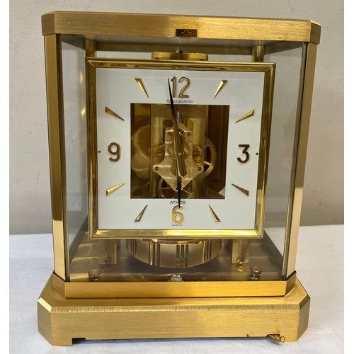 1033 - A Jaeger-Le-Coultre gilt brass Atmos mantle clock, movement numbered 390889, white enamel face. 23.5... 