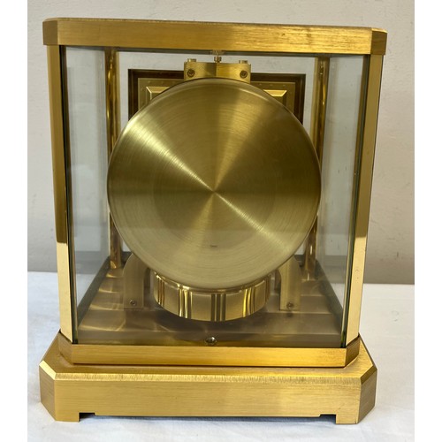 1033 - A Jaeger-Le-Coultre gilt brass Atmos mantle clock, movement numbered 390889, white enamel face. 23.5... 