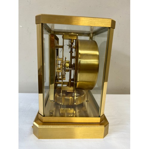 1033 - A Jaeger-Le-Coultre gilt brass Atmos mantle clock, movement numbered 390889, white enamel face. 23.5... 