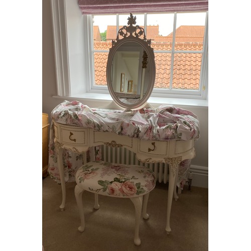 89 - Cream and gilt wood dressing table, three drawers to front on cabriole legs with oval mirror to back... 