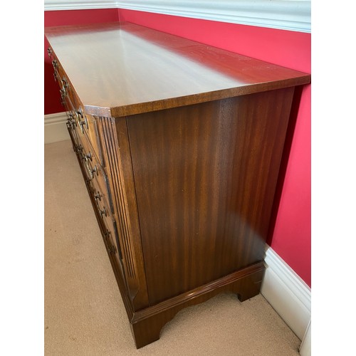 97 - A mahogany 9 drawer chest with reeded corners, bracket feet and brass handle. 152 w x 76 h x 48.5cm ... 