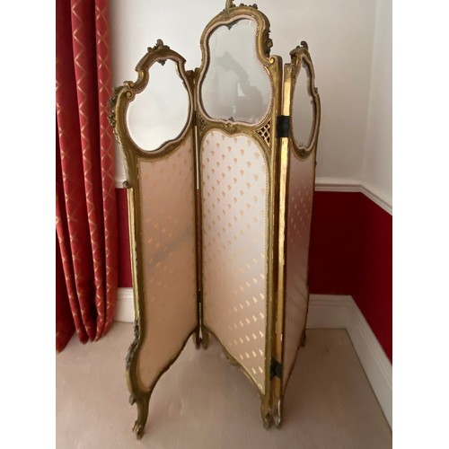 99 - A 19thC three fold gilt dressing screen, fabric panels to base with bevelled glass to top. 165 h x 1... 