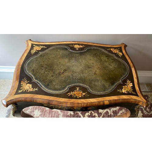 104 - Marquetry inlaid leather topped table with cabriole leg and metal mounts.