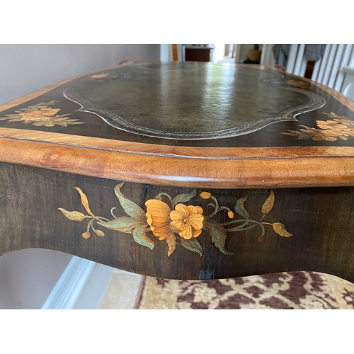 104 - Marquetry inlaid leather topped table with cabriole leg and metal mounts.