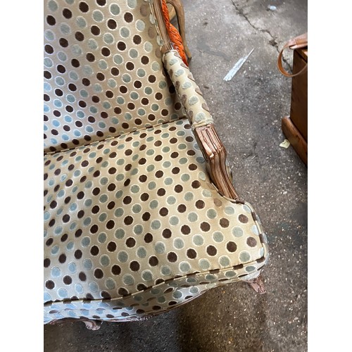 107 - Wooden framed armchair in the French style, upholstered in good quality spotty fabric. 98 h to back ... 