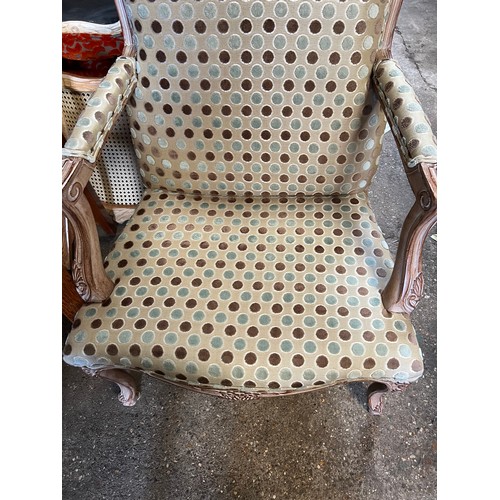 107 - Wooden framed armchair in the French style, upholstered in good quality spotty fabric. 98 h to back ... 