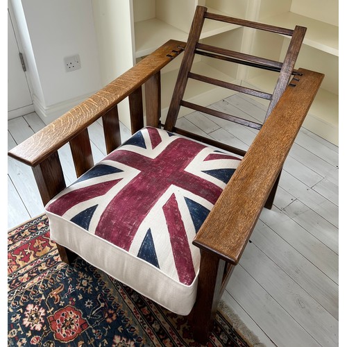 109 - Arts & Crafts reclining oak armchair with union Jack upholstered cushions. 96 h x 70 w. 55cm to top ... 