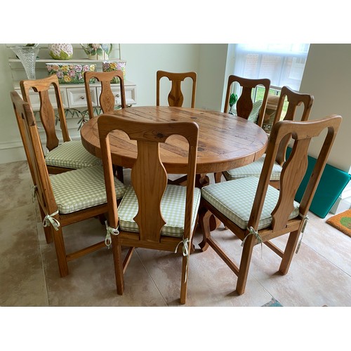 112 - Circular pine dining table and 8 chairs with upholstered cushion sets. Table 140 d x 78cm h. Chairs ... 