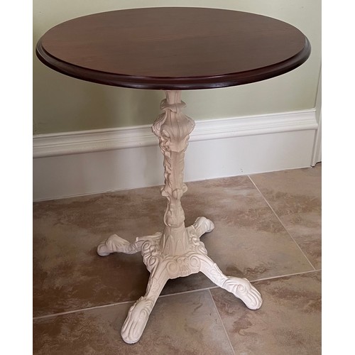 115 - Occasional table, cast iron base and mahogany circular top. 59 d x 71cm h.