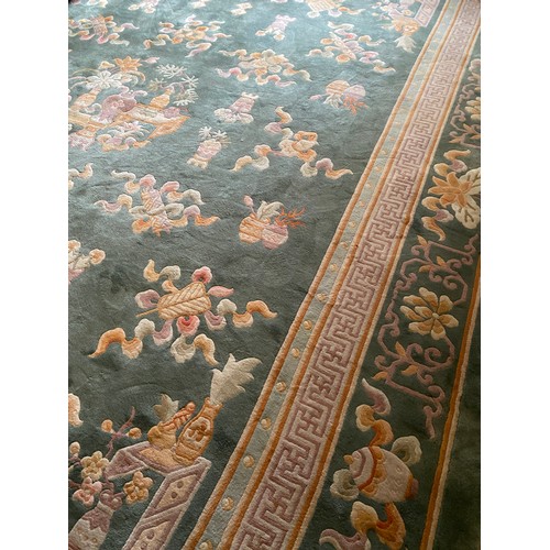 1129 - A very good quality Chinese deep pile rug Peking green. 396 x 305cm.
