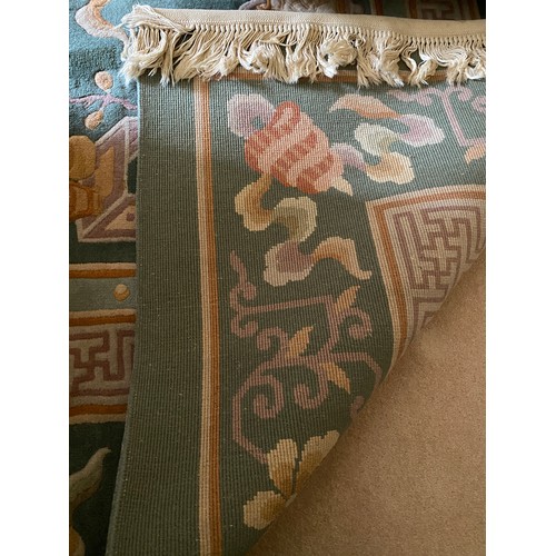 1129 - A very good quality Chinese deep pile rug Peking green. 396 x 305cm.